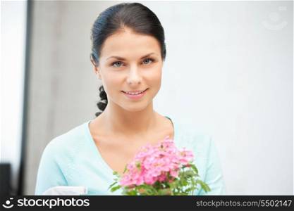 bright picture of lovely housewife with flower.