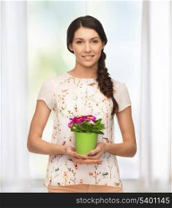 bright picture of lovely housewife with flower in pot