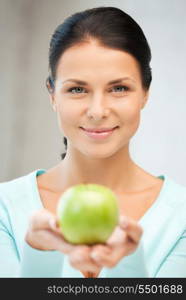 bright picture of lovely housewife with green apple