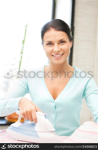 bright picture of lovely housewife with iron
