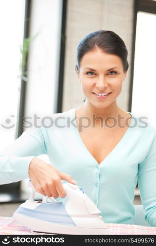 bright picture of lovely housewife with iron