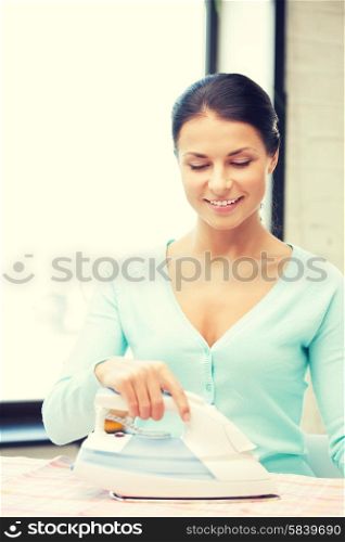 bright picture of lovely housewife with iron. lovely housewife with iron