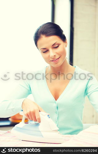 bright picture of lovely housewife with iron. lovely housewife with iron