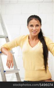bright picture of lovely housewife with step ladder