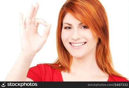 bright picture of lovely redhead showing ok sign