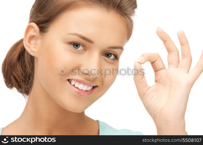 bright picture of lovely teenage girl showing ok sign