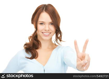 bright picture of lovely teenage girl showing victory sign