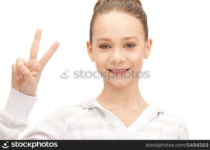 bright picture of lovely teenage girl showing victory sign