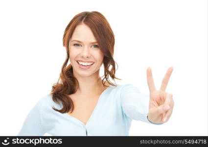 bright picture of lovely teenage girl showing victory sign