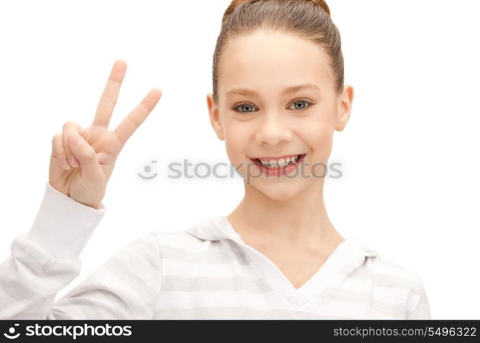 bright picture of lovely teenage girl showing victory sign