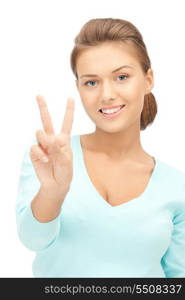 bright picture of lovely teenage girl showing victory sign