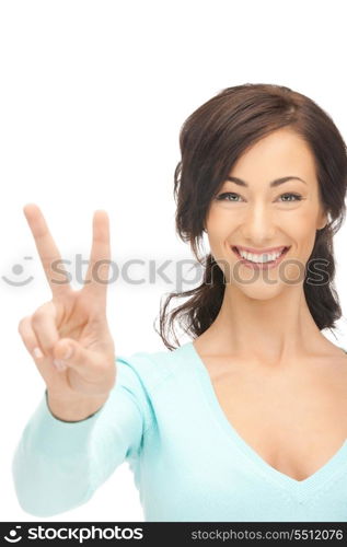 bright picture of lovely teenage girl showing victory sign