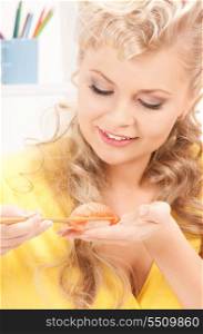 bright picture of lovely woman eating sushi