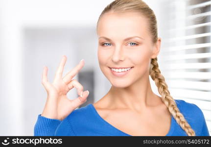 bright picture of lovely woman showing ok sign