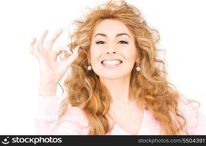 bright picture of lovely woman showing ok sign
