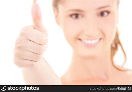 bright picture of lovely woman with thumbs up (focus on hand)