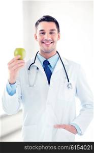 bright picture of male doctor with green apple. male doctor with green apple