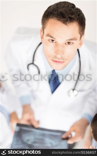 bright picture of male doctor with x-ray