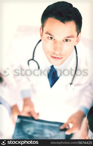 bright picture of male doctor with x-ray
