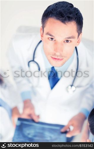 bright picture of male doctor with x-ray. male doctor with x-ray