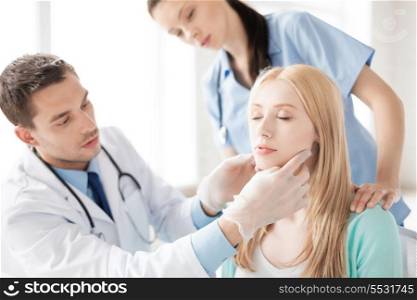 bright picture of male plastic surgeon with patient