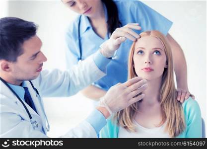 bright picture of male plastic surgeon with patient. male plastic surgeon with patient