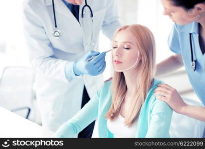 bright picture of male plastic surgeon with patient. male plastic surgeon with patient