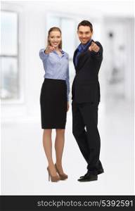 bright picture of man and woman pointing their fingers