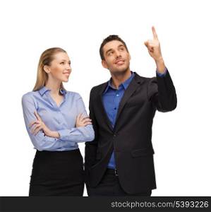 bright picture of man and woman pointing their fingers.