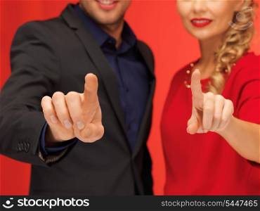 bright picture of man and woman pressing virtual button
