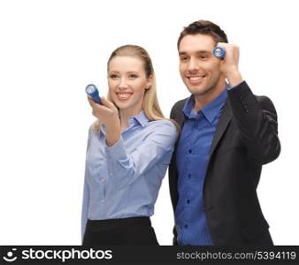 bright picture of man and woman with flashlights.