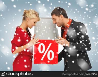 bright picture of man and woman with percent sign