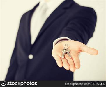 bright picture of man hand holding house keys
