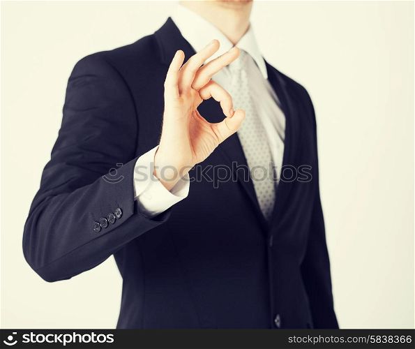 bright picture of man hands showing ok sign