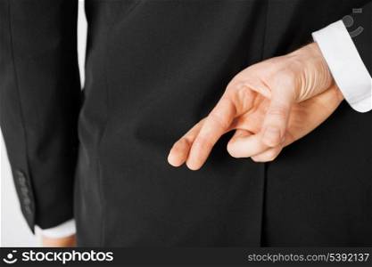 bright picture of man with crossed fingers