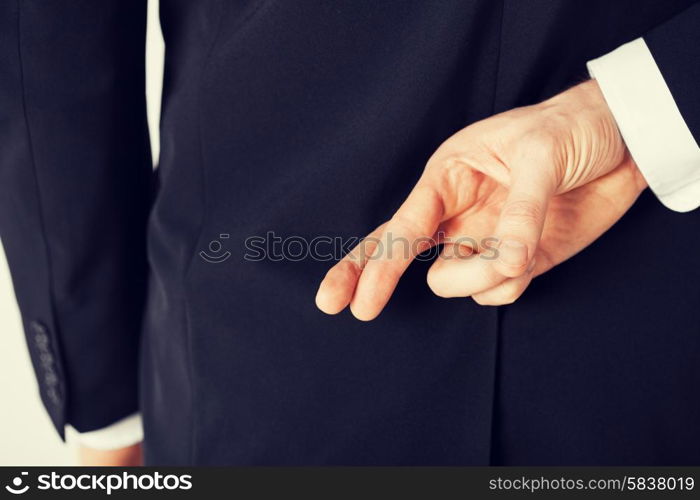 bright picture of man with crossed fingers