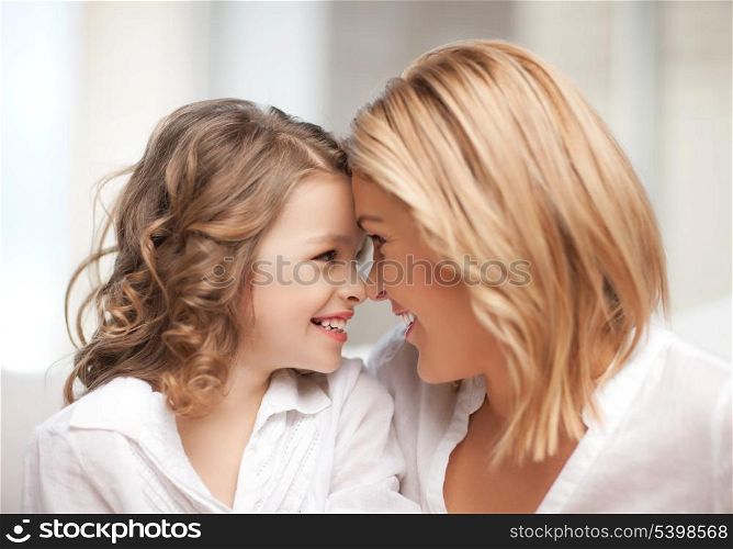 bright picture of mother and daughter cuddling
