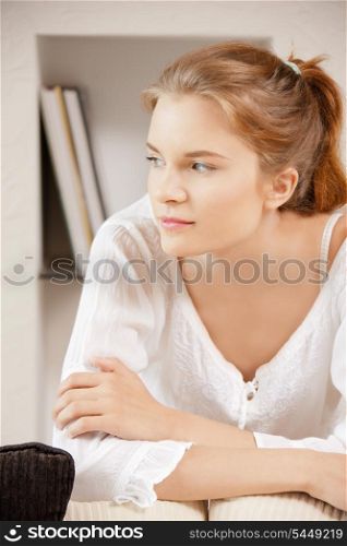 bright picture of pensive teenage girl at home