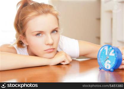 bright picture of pensive teenage girl with clock