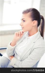 bright picture of pensive woman in office. pensive woman in office