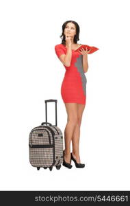 bright picture of pensive woman with suitcase and book