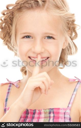 bright picture of pretty girl with finger on lips&#xA;