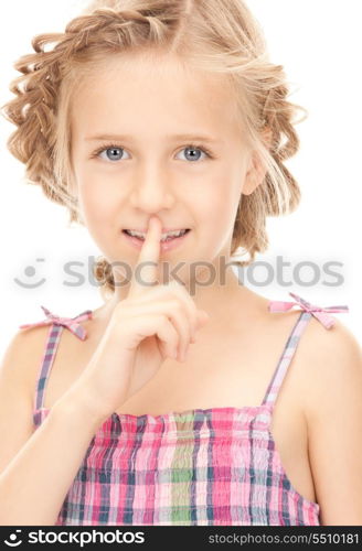 bright picture of pretty girl with finger on lips&#xA;