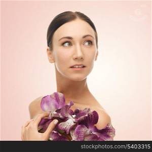 bright picture of relaxed woman with orchid flowers