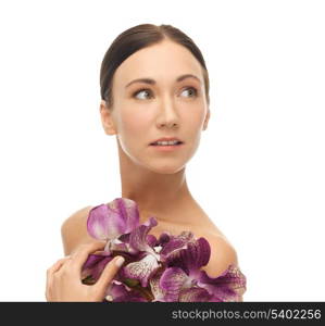 bright picture of relaxed woman with orhid flowers.