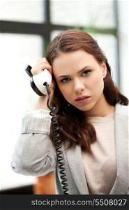 bright picture of sad businesswoman with phone