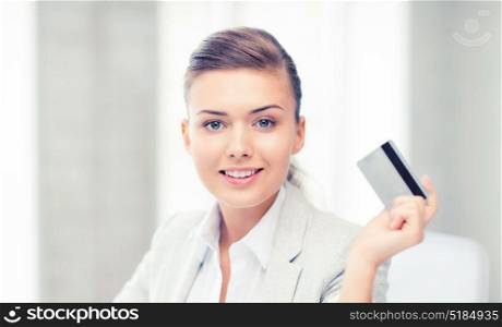bright picture of smiling businesswoman showing credit card. smiling businesswoman showing credit card