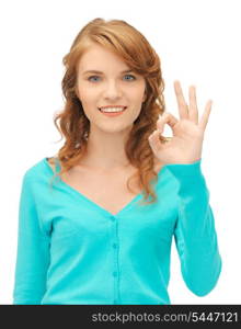 bright picture of teenage girl showing ok sign