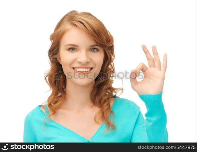 bright picture of teenage girl showing ok sign