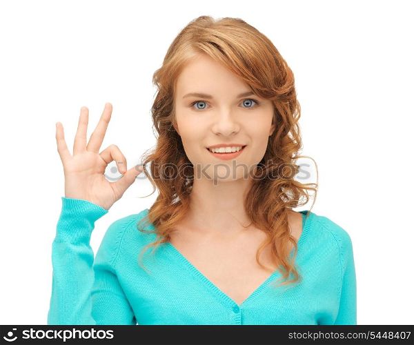 bright picture of teenage girl showing ok sign
